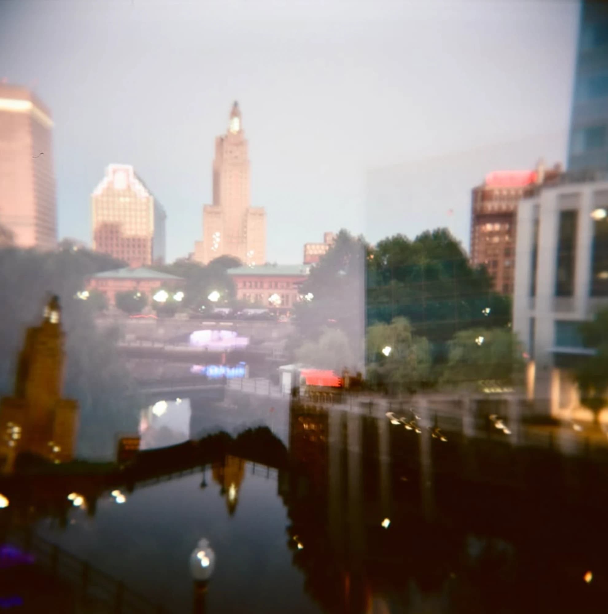 Double exposure of the Providence skyline and river at dusk